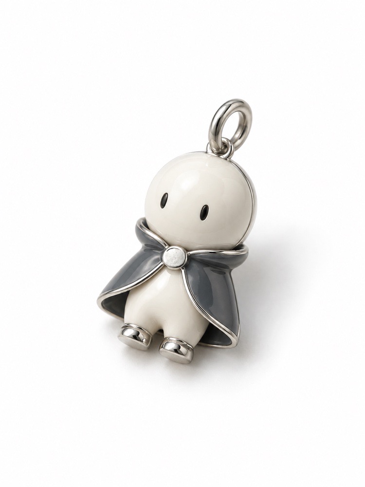 Ivory and silver collectible character charm.