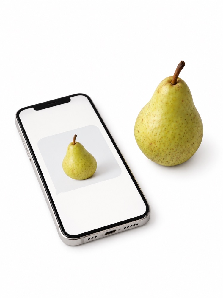 A pear beside a phone displaying its photograph.
