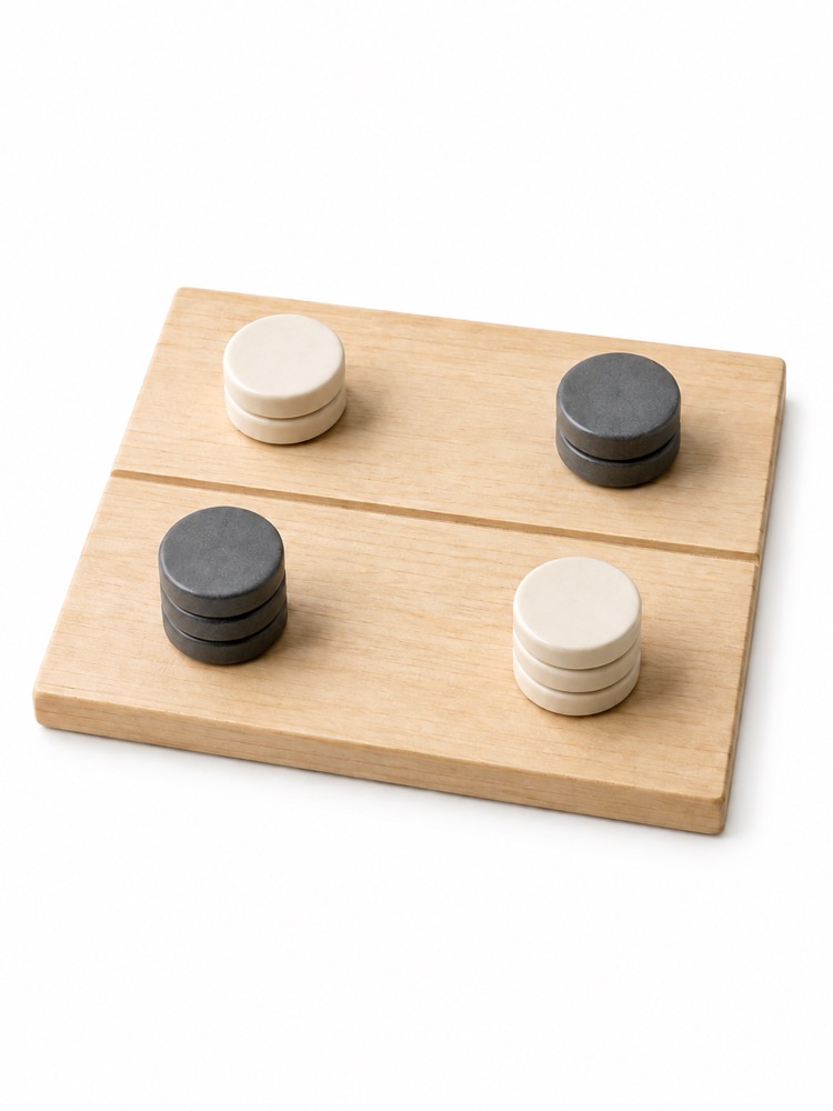 Ivory and graphite counters on a divided wooden board.