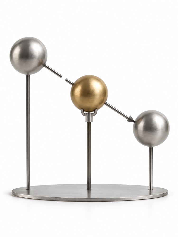 Supported metal spheres linked in a causal sculpture.