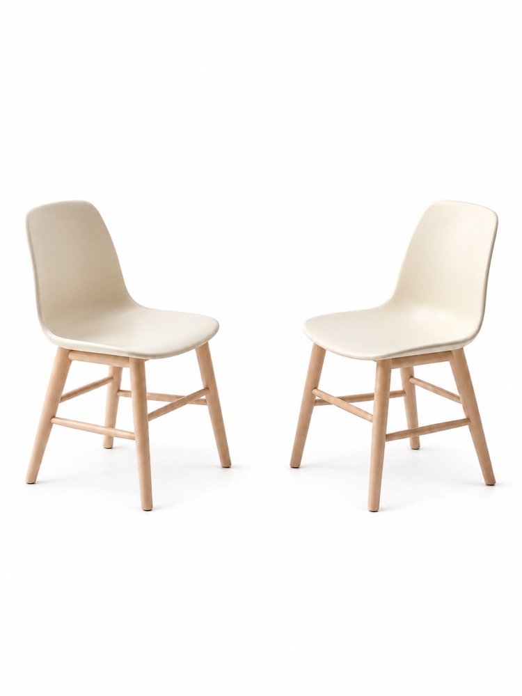 Two ivory chairs with wooden legs.